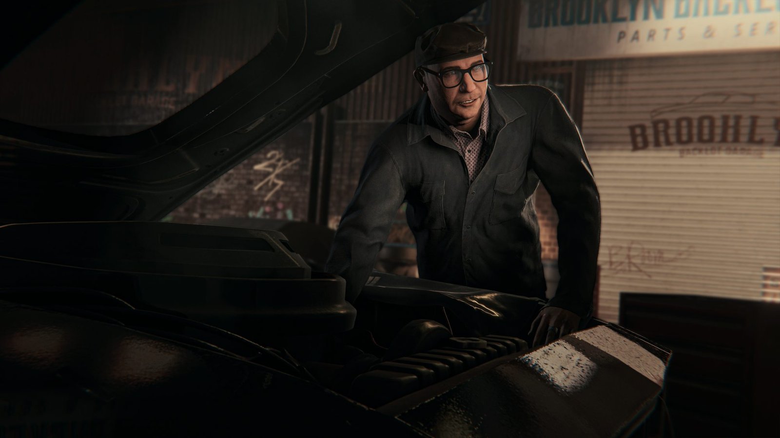 An older man in a flat cap at a garage